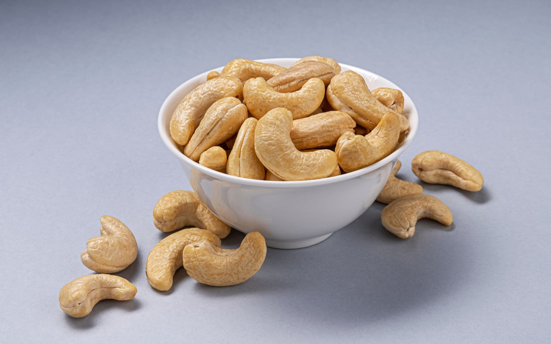 Heap of Cashew Nuts in a White Bowl 